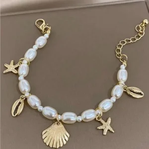 PULSERA DE PERLAS CON ESTRELLAS DE MAR